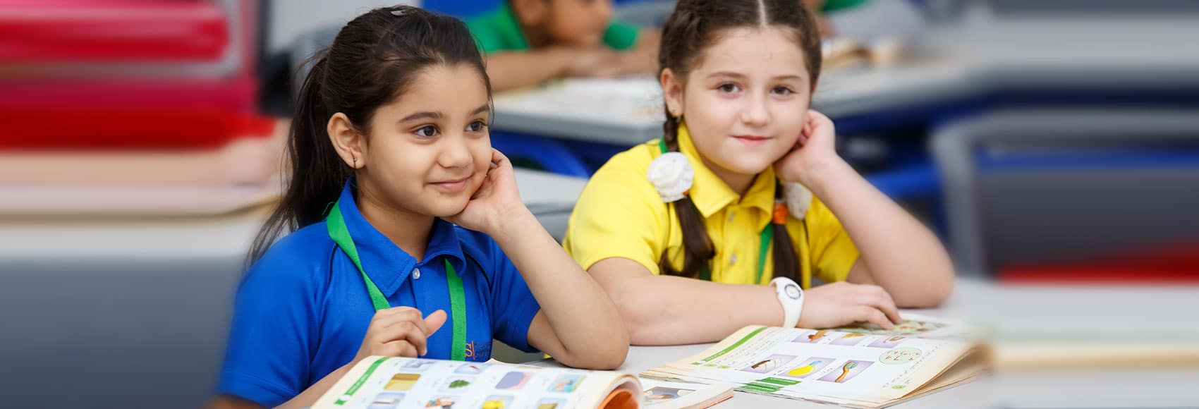 Students working together in a bright classroom, settling into a new school